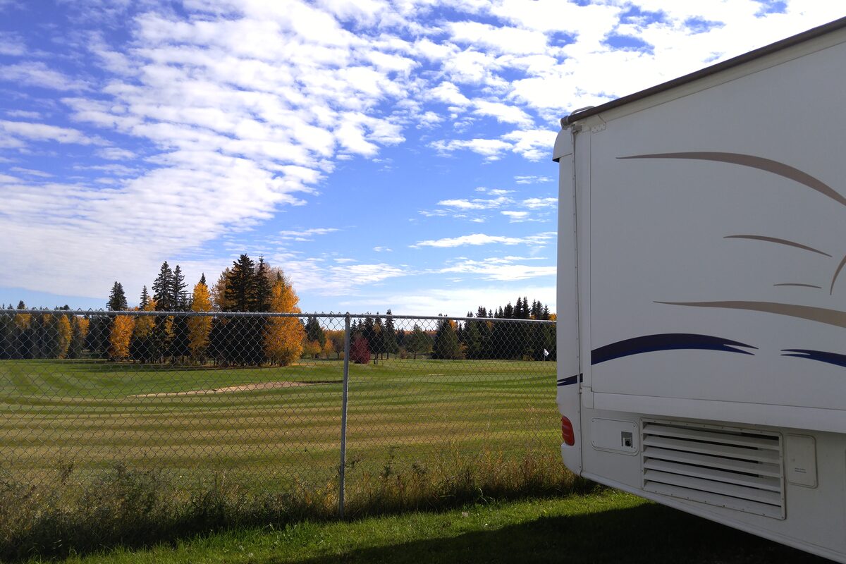 View of Edson Golf & Country Club fairway with fall-coloured trees from an RV site